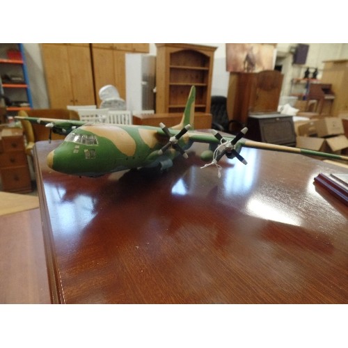 56 - MODEL PLASTIC PROPELLOR PLANE AND A LARGE MODEL OF THE TITANIC ON A WOODEN PLINTH