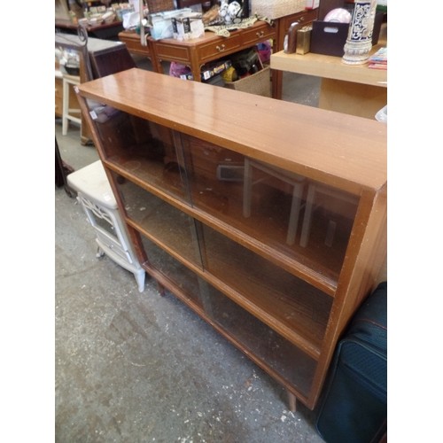 304 - MID CENTURY BOOKCASE WITH 3 SHELVES, GLASS DOORS AND  TAPERED LEGS