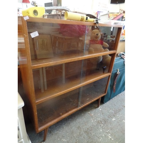 304 - MID CENTURY BOOKCASE WITH 3 SHELVES, GLASS DOORS AND  TAPERED LEGS