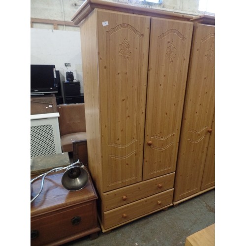 352 - PINE EFFECT WARDROBE WITH TWO DRAWERS - CARVED DETAIL IN DOORS - MISSING A DOOR KNOB