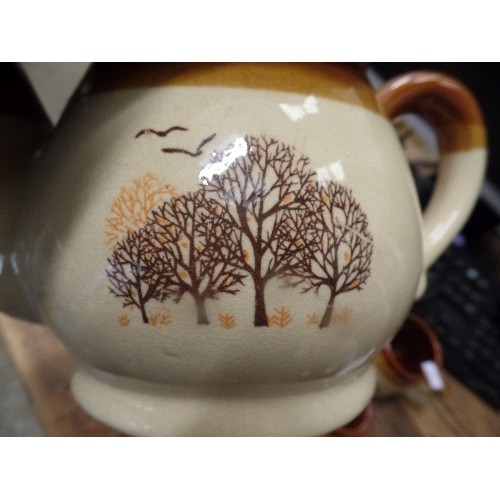 405 - POTTERY TEA SET WITH 2 EGG CUPS IN BROWNS WITH TREE DECOR