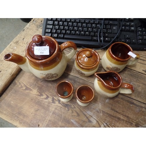 405 - POTTERY TEA SET WITH 2 EGG CUPS IN BROWNS WITH TREE DECOR