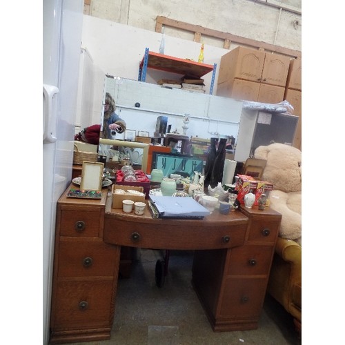 320 - 'MAPLE PRODUCTS ' OAK DRESSING TABLE WITH 7  DRAWERS AND LARGE BEVEL EDGED MIRROR