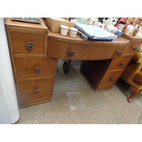 320 - 'MAPLE PRODUCTS ' OAK DRESSING TABLE WITH 7  DRAWERS AND LARGE BEVEL EDGED MIRROR