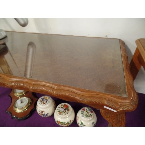 99 - GLASS-TOPPED WOODEN COFFEE TABLE. CARVED EDGE AND CABRIOLE LEGS.