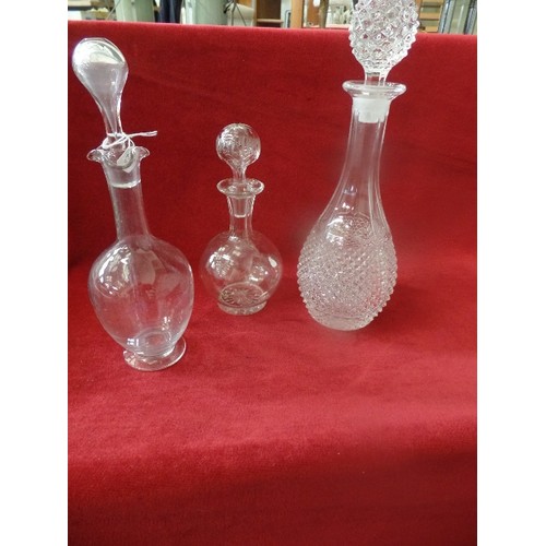 126 - 3 X GLASS DECANTERS. 1 HEAVY WINE DECANTER, AND 2 SMALLER SPIRIT DECANTERS.