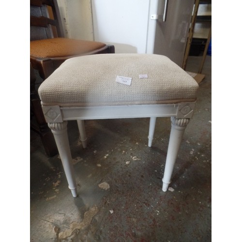 149 - DRESSING TABLE STOOL, IN CREAM WITH TAPERED LEGS.