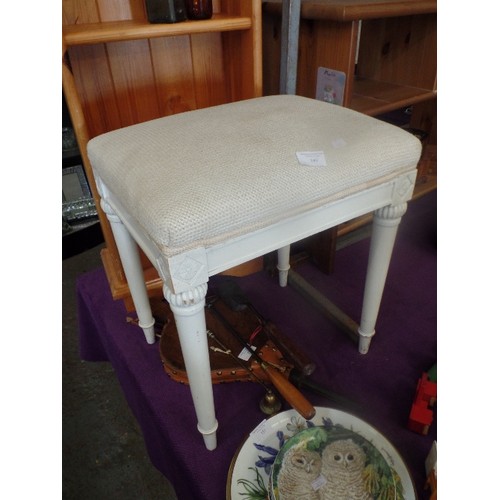 149 - DRESSING TABLE STOOL, IN CREAM WITH TAPERED LEGS.