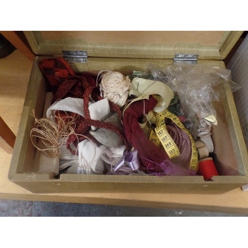 220 - VINTAGE SEWING BOX WITH HINGED LID, FULL OF BUTTONS, BRAIDS, THREADS, TAPE MEASURES ETC ETC.