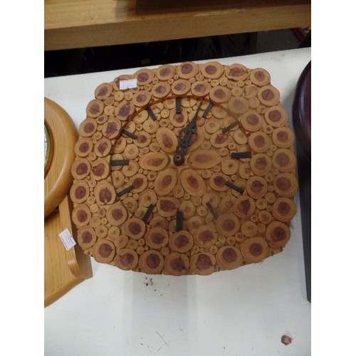 318 - 3 WALL CLOCKS. AN UNUSUAL ONE MADE FROM CROSS SECTIONS OF A BRANCH, AND 2 WITH PENDULUMS AND ROMAN N... 