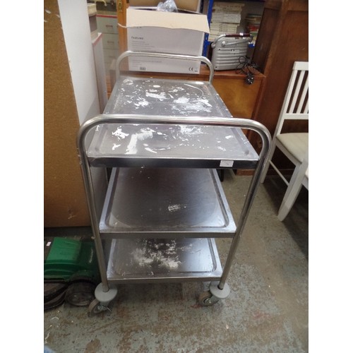 310 - LARGE STAINLESS STEEL CATERING TROLLEY ON CASTORS. 3 LEVELS-EACH TRAY APPROX 83CM L. NEEDS A CLEAN A... 