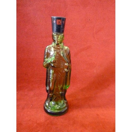 13 - A GREEN GLASS SCENT BOTTLE IN THE SHAPE OF A SOLDIER - PROBABLY AVON