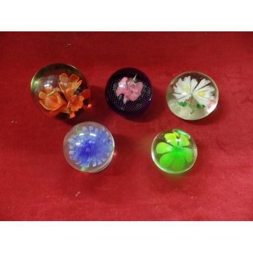 4 - 5 DECORATIVE GLASS PAPERWEIGHTS WITH FLORAL THEME IN DIFFERENT COLOURS