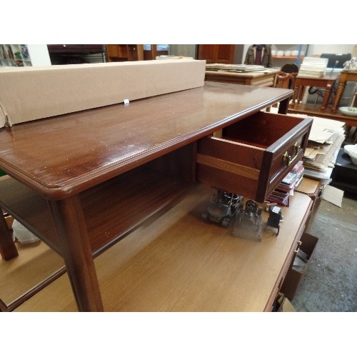 237 - LARGE POLISHED WOOD COFFEE TABLE, WITH LOWER SHELF, A DRAWER FRONT AND BACK WITH BRASS HANDLES. 122C... 