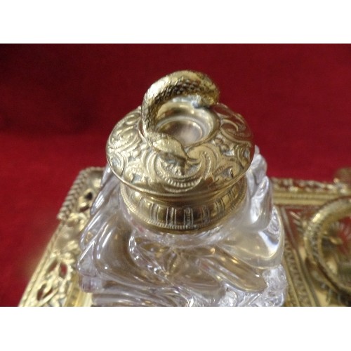 24 - A SUPERB BRASS DESK STAND WITH HEAVY GLASS INKWELLS MOUNTED WITH SNAKES. A HINGED STAMP BOX IN THE C... 