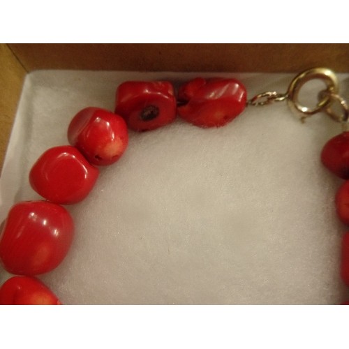 53 - A HEAVY NATURAL RED CORAL BRACELET WITH STERLING SILVER CLASP