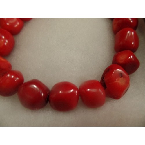 53 - A HEAVY NATURAL RED CORAL BRACELET WITH STERLING SILVER CLASP