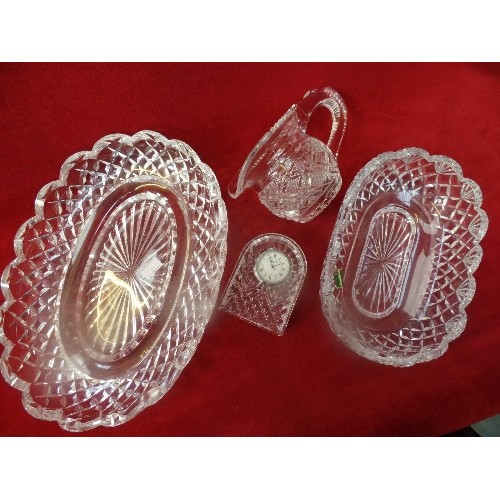 287 - FOUR PIECES OF WATERFORD CRYSTAL INCLUDING TWO BOWLS, A CREAM JUG AND A CLOCK - ALL MARKED