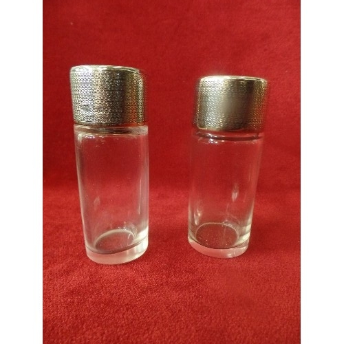 19 - A BEAUTIFUL QUALITY SET OF THREE DRESSING TABLE BOTTLES WITH ENGINE TURNED STERLING SILVER LIDS, BY ... 