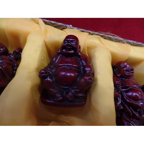 133 - SET OF SIX CHINESE RESIN LAUGHING BUDDHA FIGURES IN A FITTED BOX