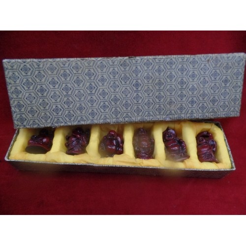 133 - SET OF SIX CHINESE RESIN LAUGHING BUDDHA FIGURES IN A FITTED BOX