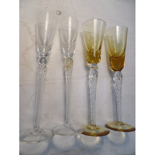 296 - FOUR SCANDINAVIAN TALL CORDIAL GLASSES WITH SPIRAL TWIST STEMS, TWO WITH AMBER COLOURED BOWLS AND FE... 