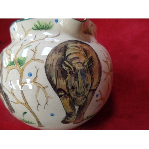 166 - AFRICAN STUDIO POTTERY JUG - HAND POTTED AND HAND PAINTED WITH RHINOS - SIGNED ON THE BASE BY ZIMBAB... 