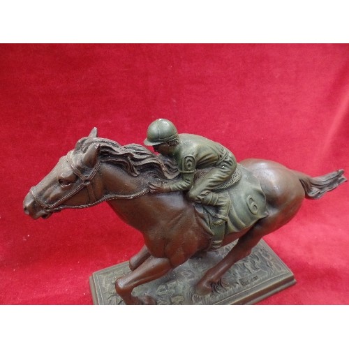 125 - A BRONZE EFFECT RESIN SCULPTURE OF A RACEHORSE 