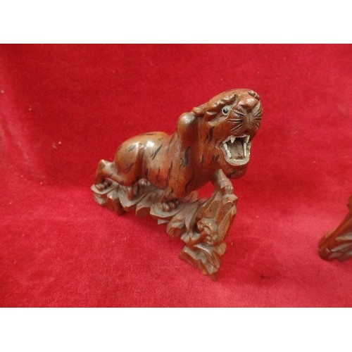 138 - A PAIR OF MID CENTURY CHINESE CARVED HARDWOOD TIGERS AND A CHINESE CARVED HARDWOOD FIGURE OF A SCRIB... 