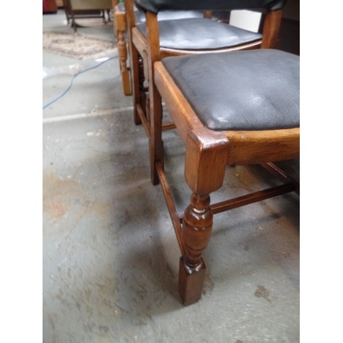 253 - SET OF FOUR 193O'S DINING CHAIRS - THE BACKS IN ART DECO SHAPE WITH CANTED CORNERS, IN BLACK LEATHER... 