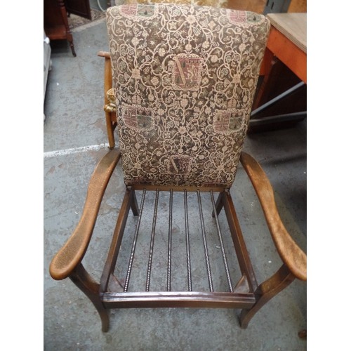 259B - A MID CENTURY WOODEN FRAMED ARMCHAIR WITH SPRUNG SEAT