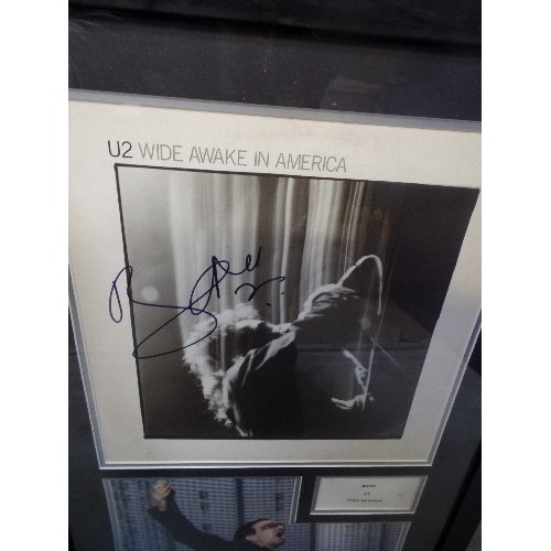 319F - U2. BONO/PAUL HEWSON INTEREST. SIGNED & FRAMED 'WIDE AWAKE IN AMERICA' PHOTOGRAPHS X 2 OF BONO ON ST... 