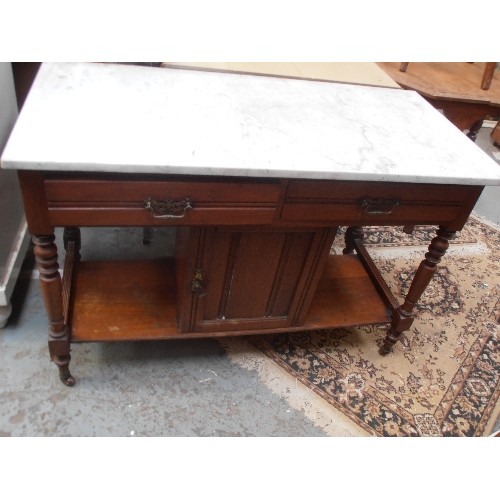 446 - EDWARDIAN AMERICAN WALNUT WASH STAND. WITH MARBLE TOP. 2 DRAWERS AND CENTRAL CUPBOARD. 107CM W.