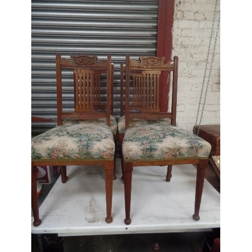 447 - SET OF 4 EDWARDIAN OAK DINING CHAIRS. UPHOLSTERED SEATS. TOP RAILS IN ART NOUVEAU STYLE.