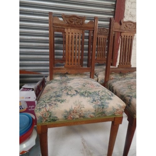 447 - SET OF 4 EDWARDIAN OAK DINING CHAIRS. UPHOLSTERED SEATS. TOP RAILS IN ART NOUVEAU STYLE.