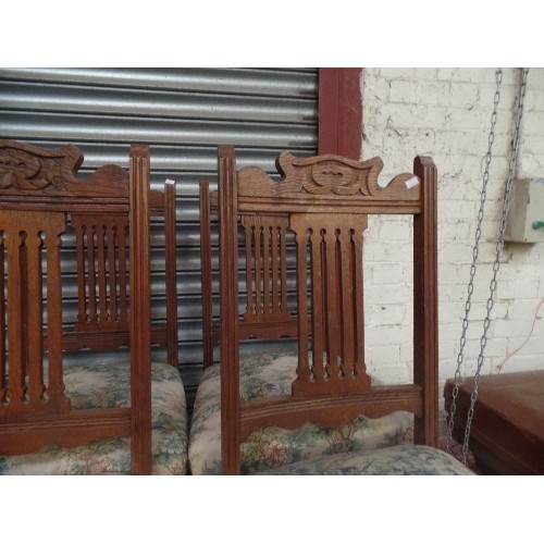 447 - SET OF 4 EDWARDIAN OAK DINING CHAIRS. UPHOLSTERED SEATS. TOP RAILS IN ART NOUVEAU STYLE.