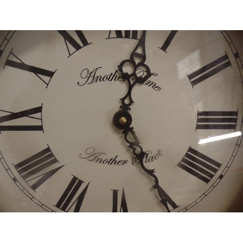 235 - SOLID PINE FRAMED WALL CLOCK, WITH ROMAN NUMERALS 'ANOTHER TIME ANOTHER PLACE'