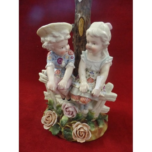 142 - VINTAGE CERAMIC OF 2 GIRLS SAT CHATTING ON A FENCE. 28CM H.