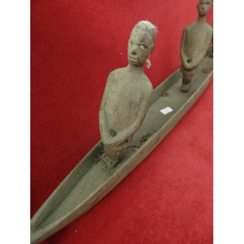 155 - VINTAGE CRUDELY CARVED AFRICAN 3 MEN IN A WOODEN BOAT. APPROX 76CM L