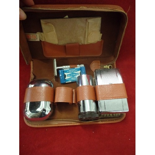 176 - 2 VINTAGE GROOMING KITS, ONE HAS SOAP DISH, BRUSH, RAZOR ETC, THE SMALLER ONE HAS TINY MIRROR, NAIL ... 