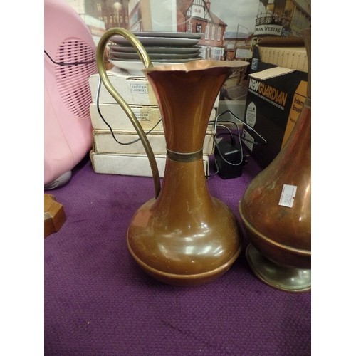 222 - 2 COPPER JUGS, AND A HAMMERED COPPER VASE.