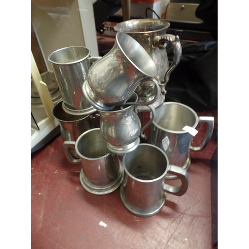 309 - 9 X VINTAGE PEWTER TANKARDS.