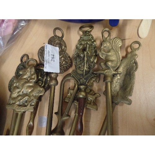 284 - 8 X VINTAGE BRASS FIRESIDE TOASTING FORKS, TOGETHER WITH ANOTHER FIRESIDE IMPLEMENT.