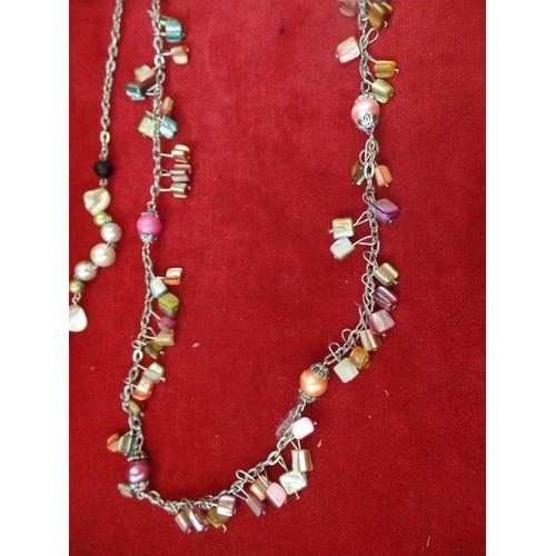 29 - 2 PIA NECKLACES 1 48 INCHES LONG 1920`S FLAPPER STYLE BRIGHT MULTI COLOURED STONES AND BEADS,  THE O... 