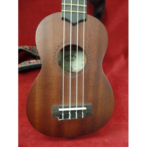 303 - KALA KA-158 UKELELE, COMPLETE WITH EMBROIDERED STRAP, AND A PROTECTIVE PADDED MAHALO BAG.