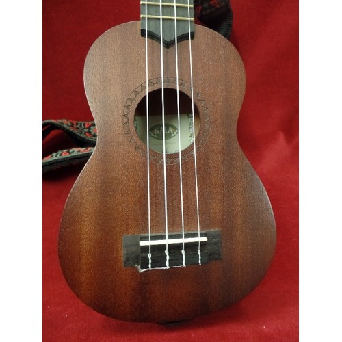 303 - KALA KA-158 UKELELE, COMPLETE WITH EMBROIDERED STRAP, AND A PROTECTIVE PADDED MAHALO BAG.