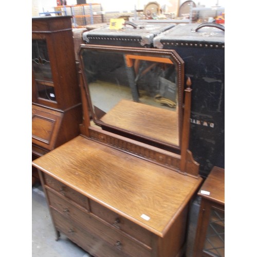 527 - 1920'S OAK DRESSING TABLE WITH TWO OVER TWO DRAWERS AND LARGE SWIVEL MIRROR WITH BEVELLED GLASS - ON... 