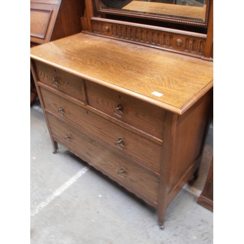 527 - 1920'S OAK DRESSING TABLE WITH TWO OVER TWO DRAWERS AND LARGE SWIVEL MIRROR WITH BEVELLED GLASS - ON... 