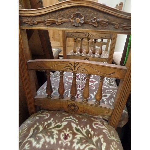 528 - SET OF 3 EDWARDIAN OAK DINING CHAIRS, WITH UPHOLSTERED SEATS. CARVED FLOWER MOTIF, AND SHORT SPINDLE... 