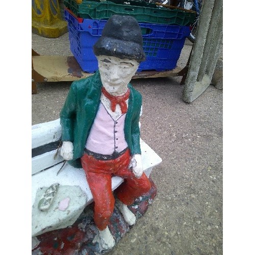 628 - HAND PAINTED CONCRETE GARDEN ORNAMENT OF MAN ON A BENCH